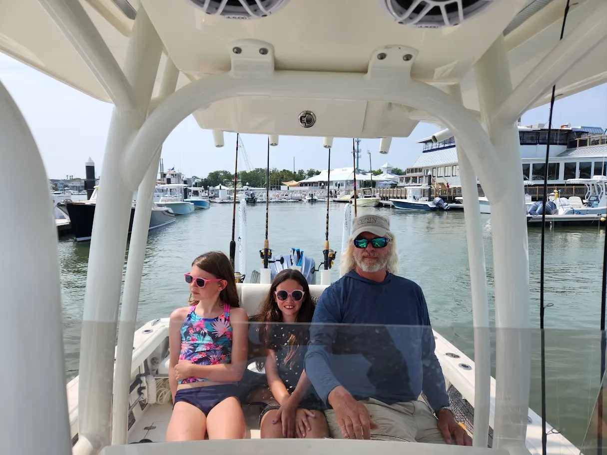 Guests relaxing beneath the Pathfinder canopy at the marina