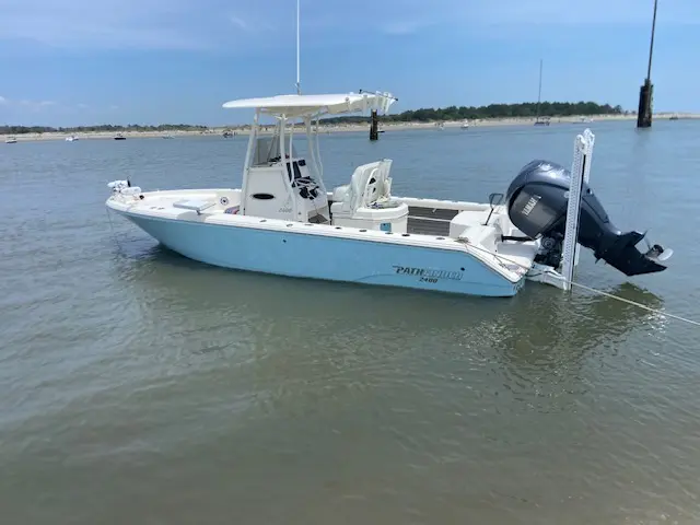 Captain Fritz's white and blue Pathfinder on the water